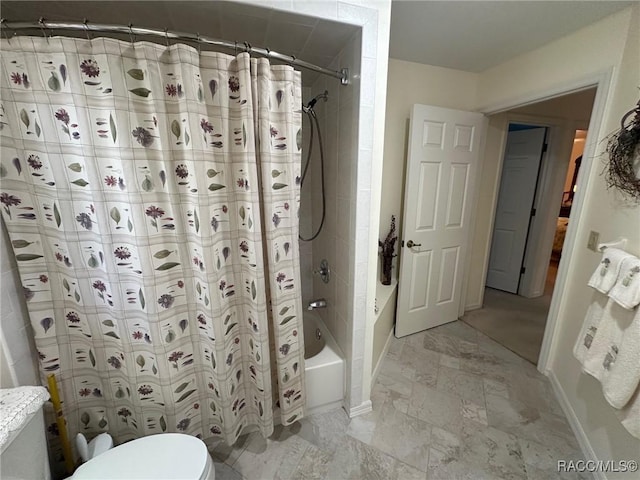 bathroom featuring toilet and shower / bath combo