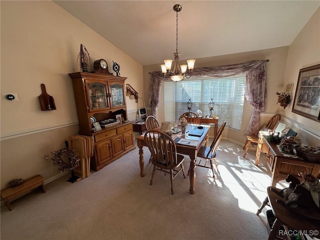 carpeted dining space with a notable chandelier and lofted ceiling