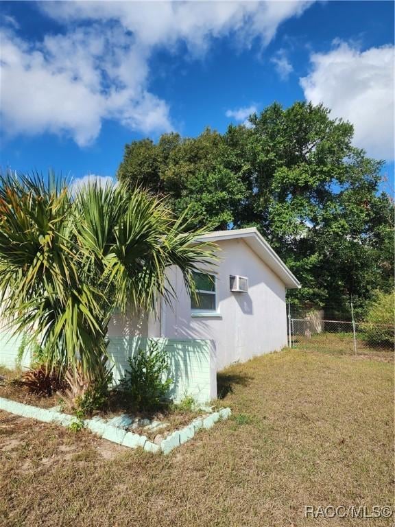 view of home's exterior featuring a lawn