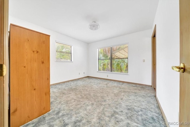 10741 W Pine Bark Ln, Crystal River, FL 34429 - unfurnished bedroom with carpet flooring and baseboards
