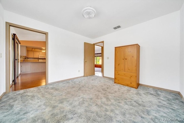 10741 W Pine Bark Ln, Crystal River, FL 34429 - spare room with carpet floors and a sink