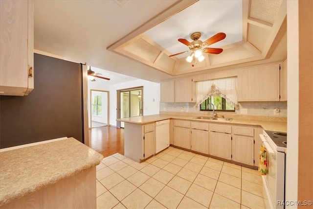 10741 W Pine Bark Ln, Crystal River, FL 34429 - kitchen featuring white appliances, a ceiling fan, a tray ceiling, a peninsula, and light countertops