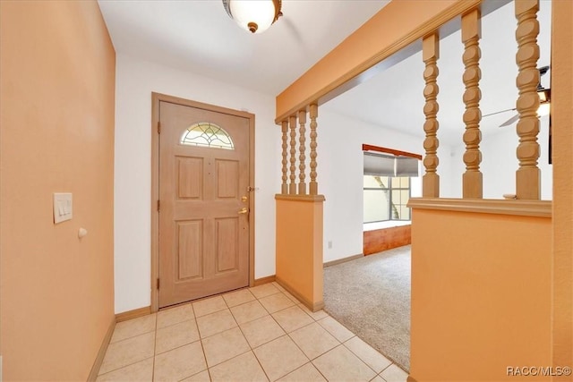 10741 W Pine Bark Ln, Crystal River, FL 34429 - carpeted foyer with baseboards and tile patterned floors