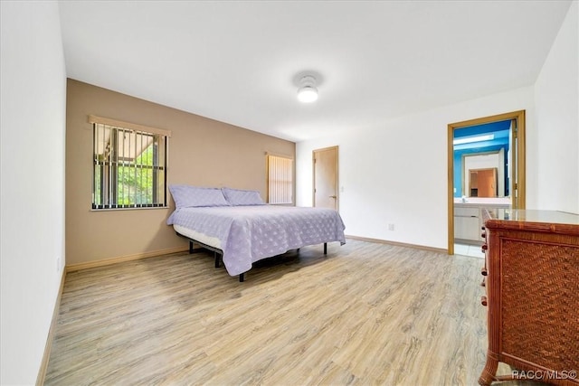 10741 W Pine Bark Ln, Crystal River, FL 34429 - bedroom with light wood-type flooring and baseboards