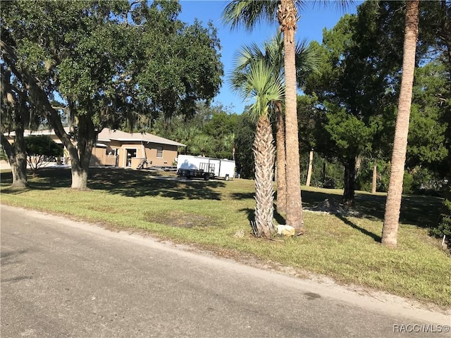 10741 W Pine Bark Ln, Crystal River, FL 34429 - view of front facade featuring a front yard