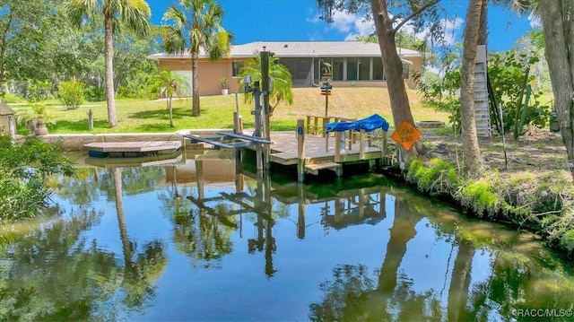 10741 W Pine Bark Ln, Crystal River, FL 34429 - dock with a lawn and a water view