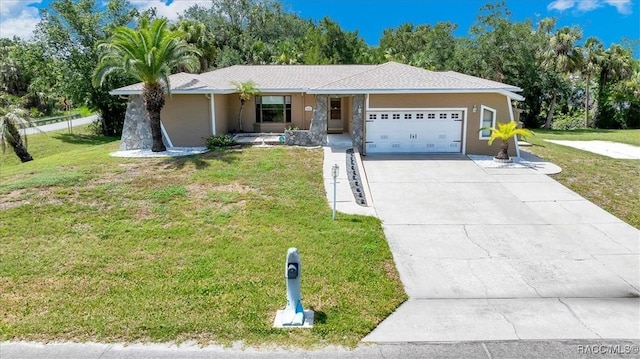 10741 W Pine Bark Ln, Crystal River, FL 34429 - ranch-style house with a garage, concrete driveway, a front lawn, and a porch