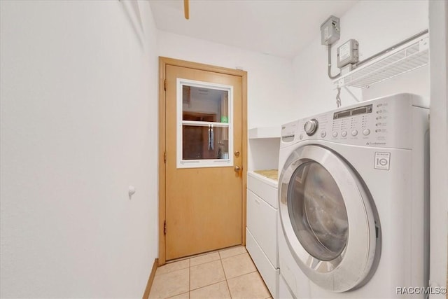 10741 W Pine Bark Ln, Crystal River, FL 34429 - laundry area featuring separate washer and dryer and light tile patterned floors