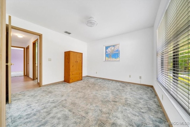 10741 W Pine Bark Ln, Crystal River, FL 34429 - unfurnished bedroom featuring carpet and baseboards