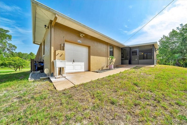 10741 W Pine Bark Ln, Crystal River, FL 34429 - rear view of property with a sunroom, stucco siding, and a lawn