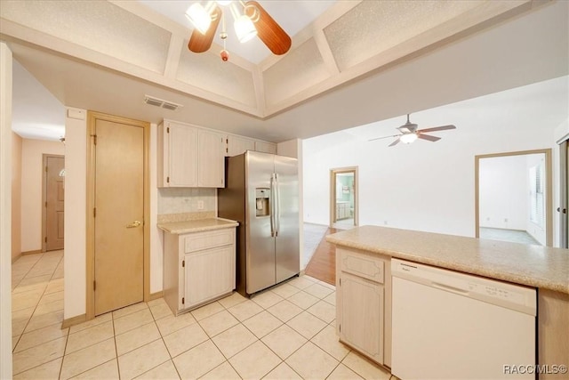 10741 W Pine Bark Ln, Crystal River, FL 34429 - kitchen with dishwasher, stainless steel fridge, ceiling fan, light tile patterned floors, and a towering ceiling