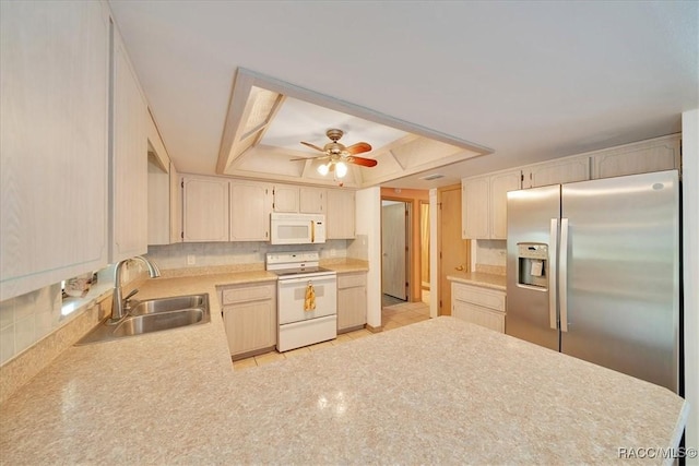 10741 W Pine Bark Ln, Crystal River, FL 34429 - kitchen with white appliances, a tray ceiling, backsplash, and light countertops