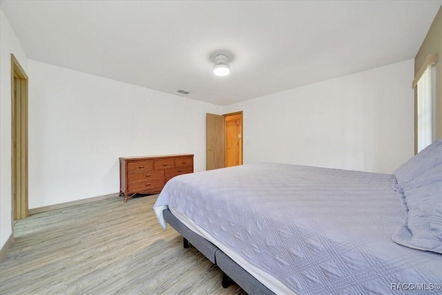 10741 W Pine Bark Ln, Crystal River, FL 34429 - bedroom featuring light wood-style floors and baseboards