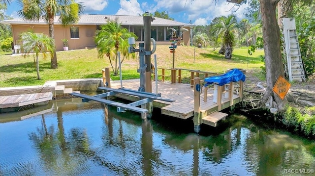10741 W Pine Bark Ln, Crystal River, FL 34429 - dock featuring a lawn and a water view