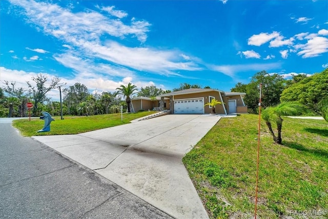 10741 W Pine Bark Ln, Crystal River, FL 34429 - view of front of property with an attached garage, concrete driveway, and a front yard
