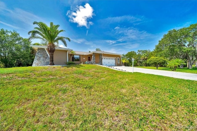 10741 W Pine Bark Ln, Crystal River, FL 34429 - ranch-style house featuring concrete driveway, an attached garage, and a front yard