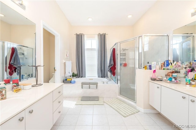 bathroom with a sink, tile patterned flooring, two vanities, a garden tub, and a stall shower