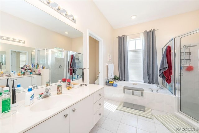 full bath with vanity, toilet, tile patterned floors, a shower stall, and a garden tub