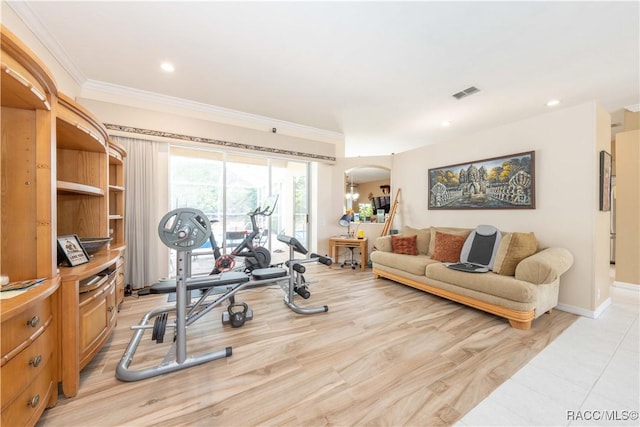 workout room with visible vents, crown molding, recessed lighting, arched walkways, and light wood-style flooring