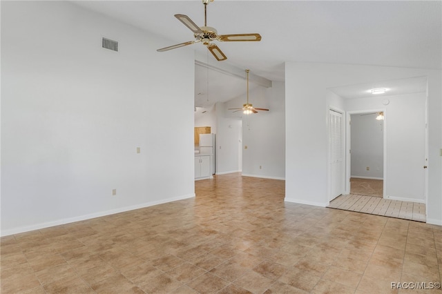 unfurnished room featuring baseboards, attic access, visible vents, and a ceiling fan