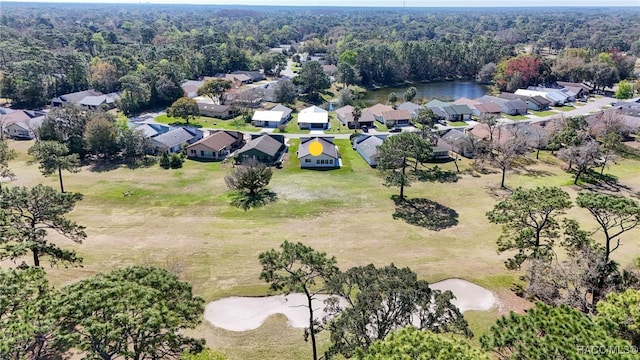 aerial view featuring a residential view and a view of trees