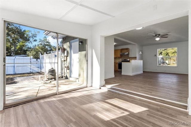 interior space with light hardwood / wood-style flooring and ceiling fan