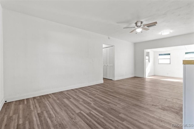 unfurnished room featuring wood-type flooring and ceiling fan