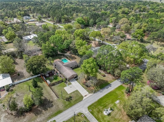 drone / aerial view featuring a view of trees