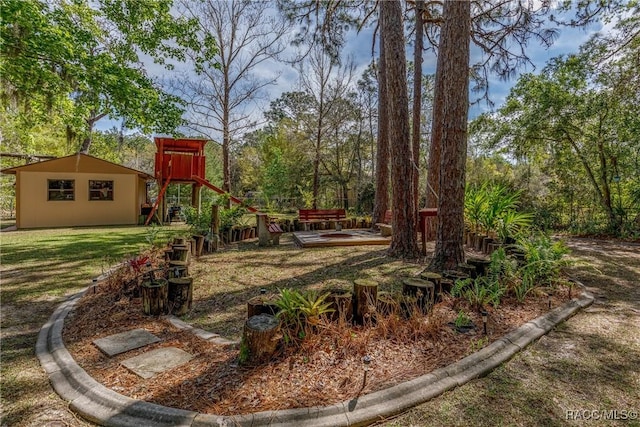 view of yard featuring an outbuilding and a wooden deck