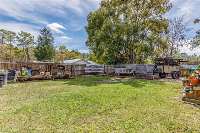 view of yard with a fenced backyard and a wooden deck