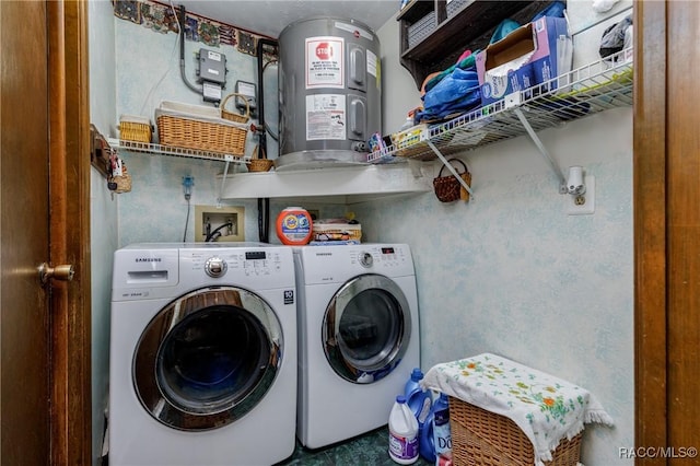 laundry area featuring water heater, laundry area, and washing machine and clothes dryer