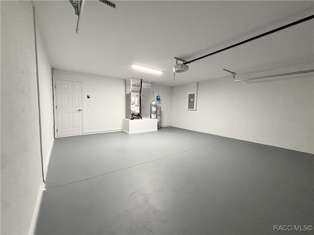 6431 SW 145th Ln, Ocala, FL 34473 - garage with electric panel, heating unit, and a garage door opener