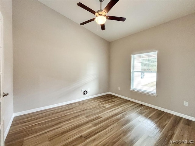 6431 SW 145th Ln, Ocala, FL 34473 - unfurnished room with wood finished floors, vaulted ceiling, and a ceiling fan