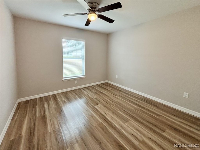 6431 SW 145th Ln, Ocala, FL 34473 - unfurnished room featuring wood finished floors and a ceiling fan