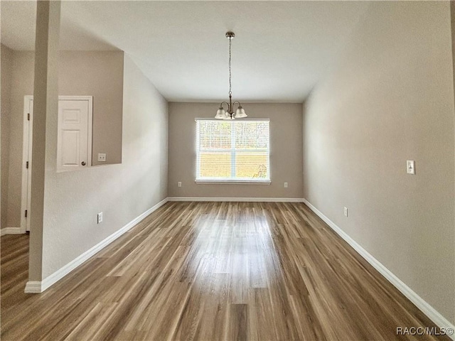 6431 SW 145th Ln, Ocala, FL 34473 - unfurnished dining area with a chandelier and wood finished floors
