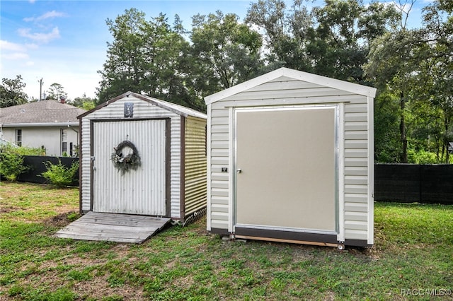 view of shed with fence