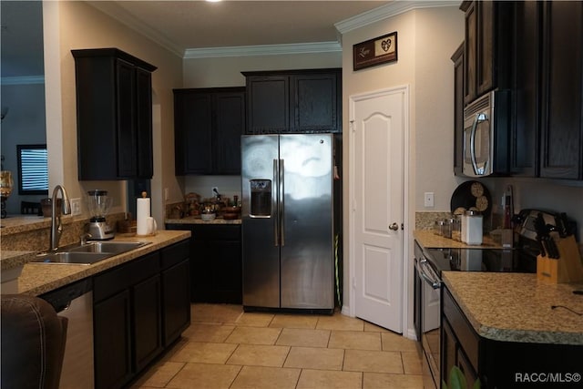 kitchen with crown molding, light tile patterned flooring, appliances with stainless steel finishes, and a sink