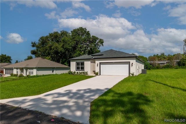 view of front facade with a garage, a front lawn, and central air condition unit