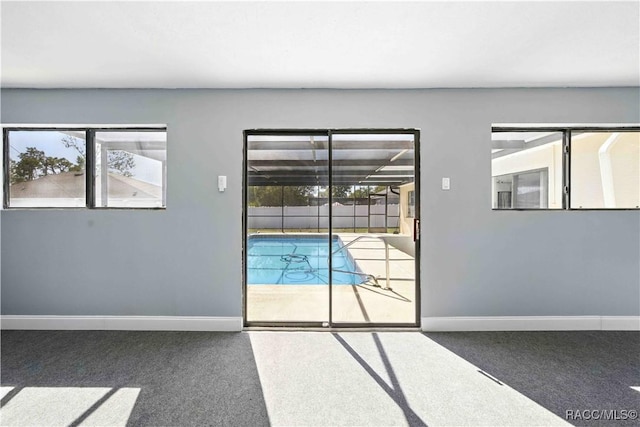 entryway with baseboards and a healthy amount of sunlight