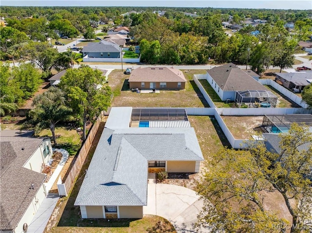 birds eye view of property with a residential view