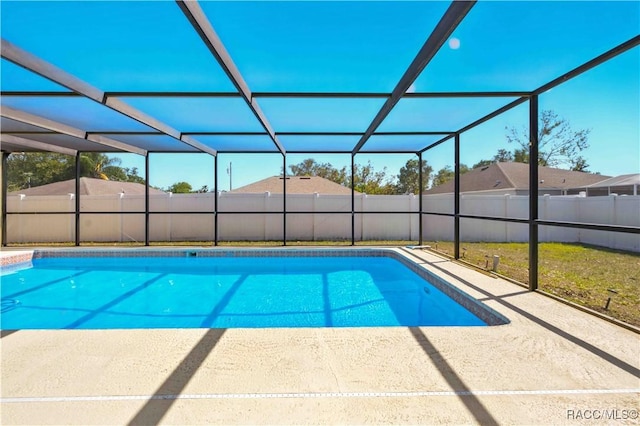 view of swimming pool featuring a fenced in pool, a patio area, a lanai, and fence