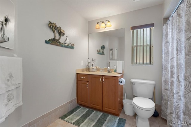 bathroom featuring tile patterned floors, vanity, and toilet