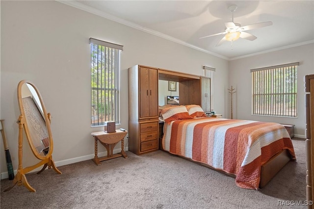 carpeted bedroom featuring ceiling fan and ornamental molding