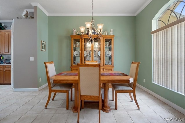 dining room with light tile patterned floors, crown molding, and a chandelier