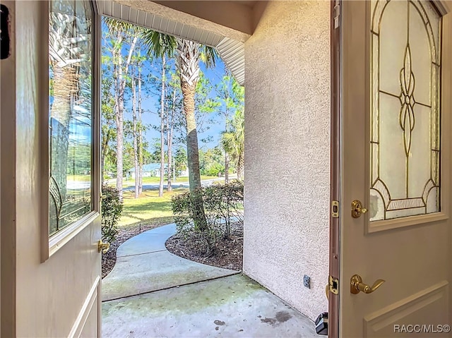 doorway to outside with concrete floors