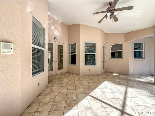 view of patio / terrace featuring ceiling fan and french doors