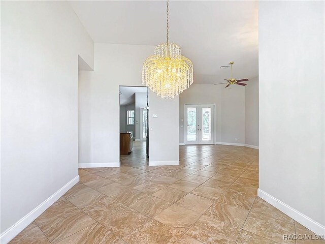 unfurnished living room featuring ceiling fan and high vaulted ceiling