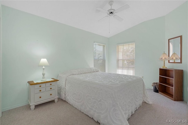 bedroom with ceiling fan, light carpet, and lofted ceiling