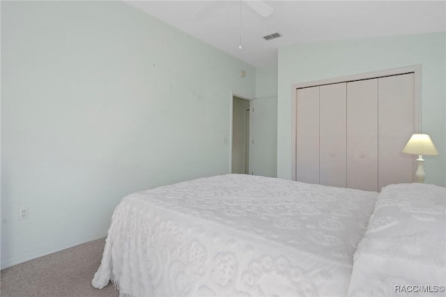 bedroom with light carpet, a closet, and ceiling fan