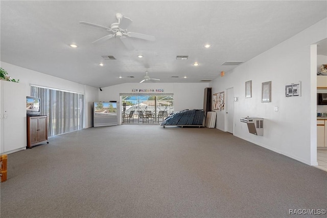 interior space featuring ceiling fan, lofted ceiling, and light carpet